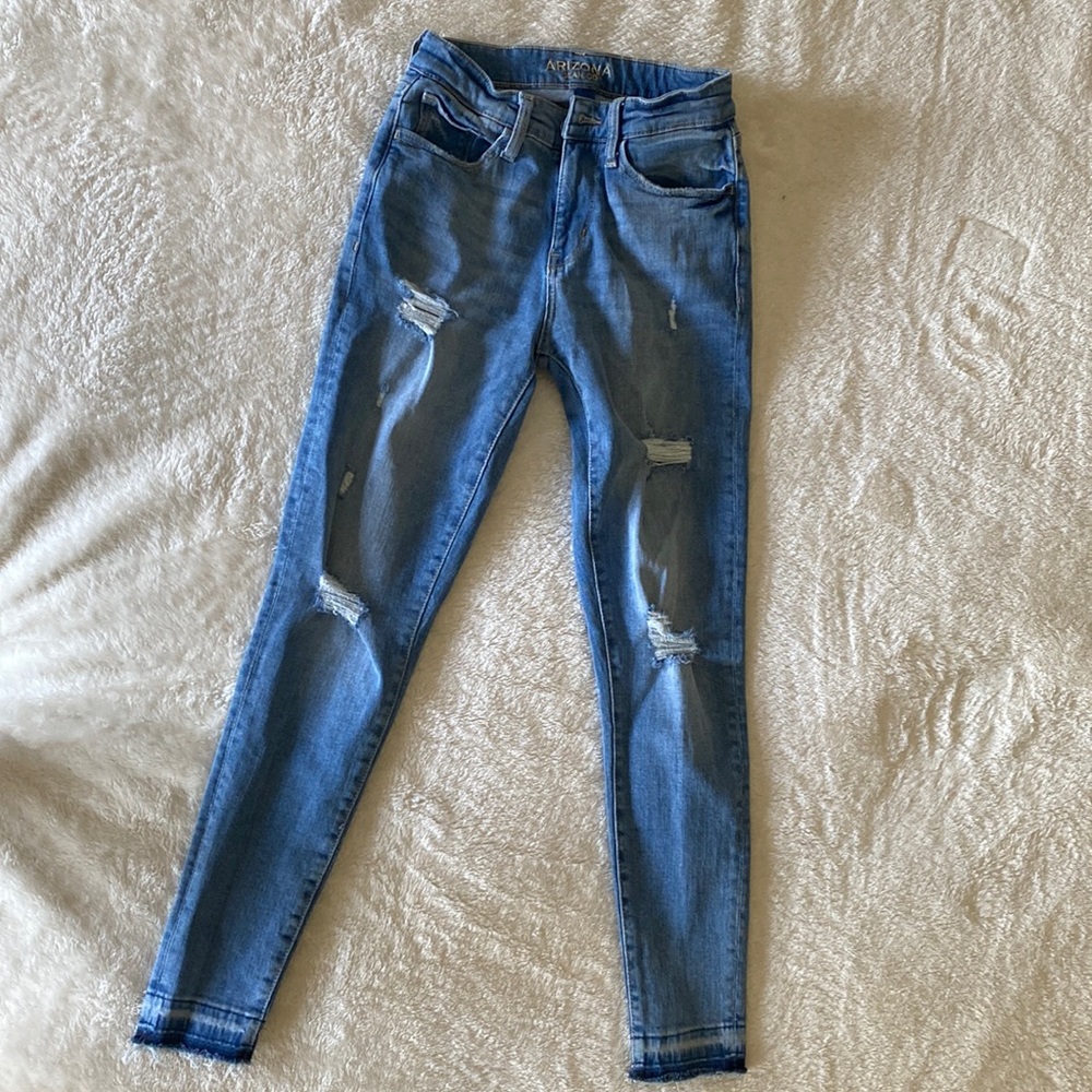 Light blue skinny jeans with rips
